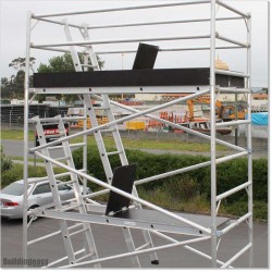 6M Scaffolding Including Two Separate Ladders and Three  Planks.